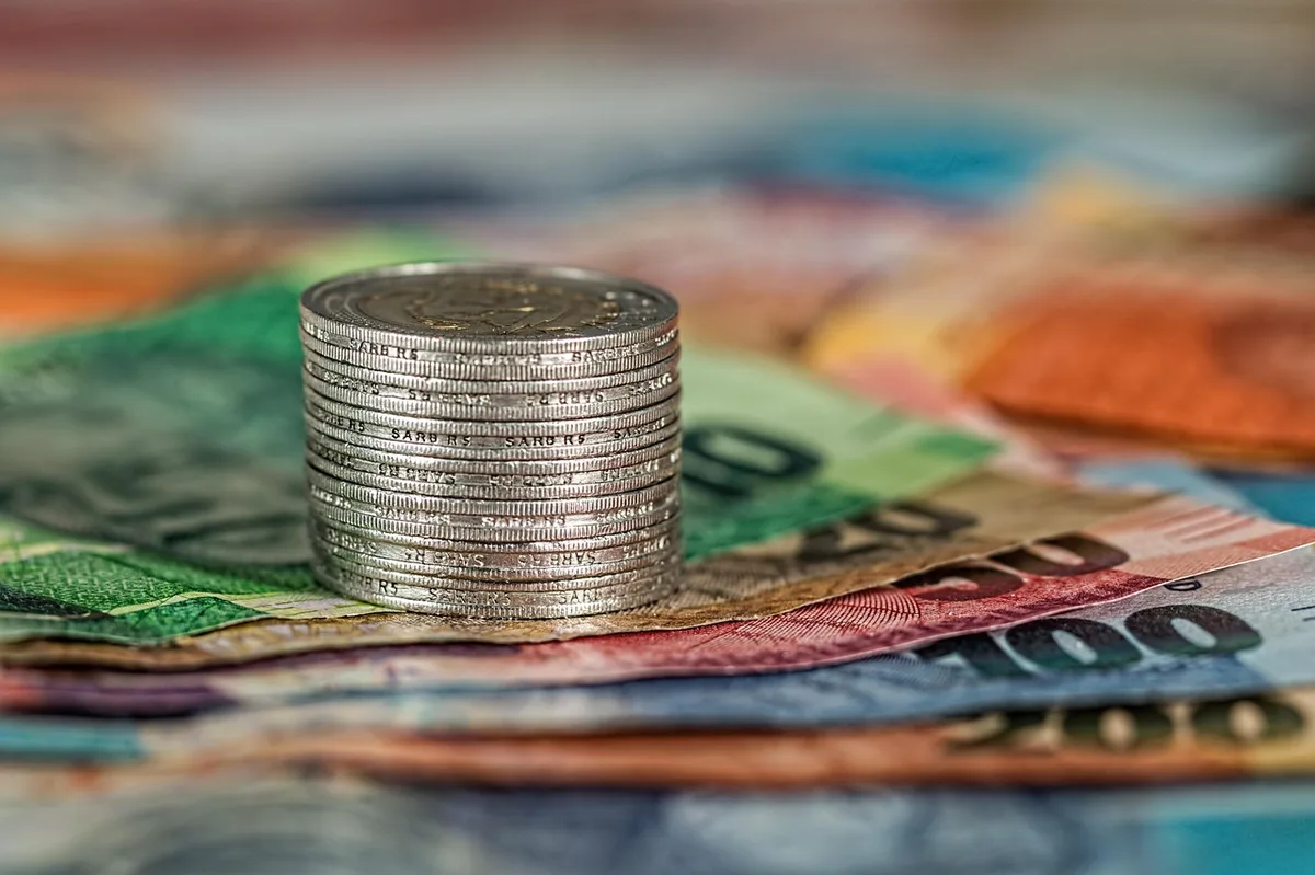 Australian dollar banknotes spread on a surface representing dividend income