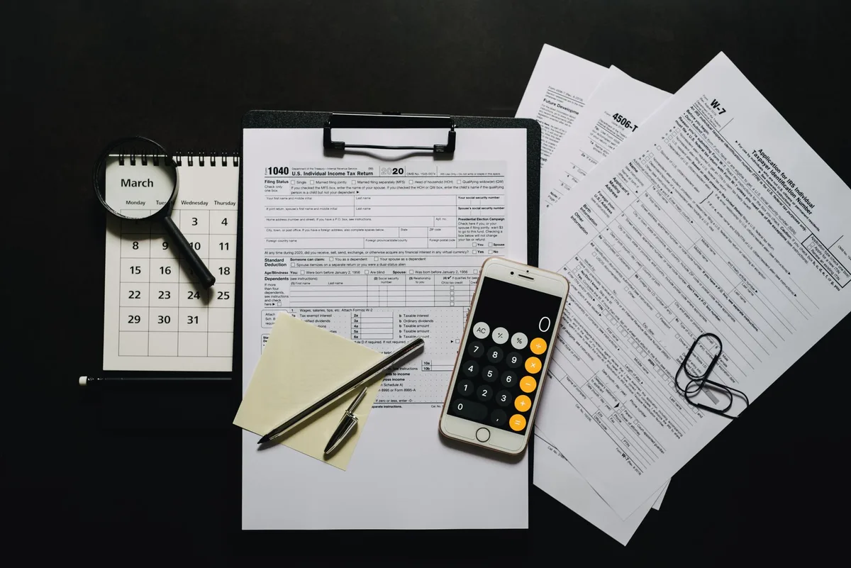 Tax paperwork and forms on a desk ready for lodgment