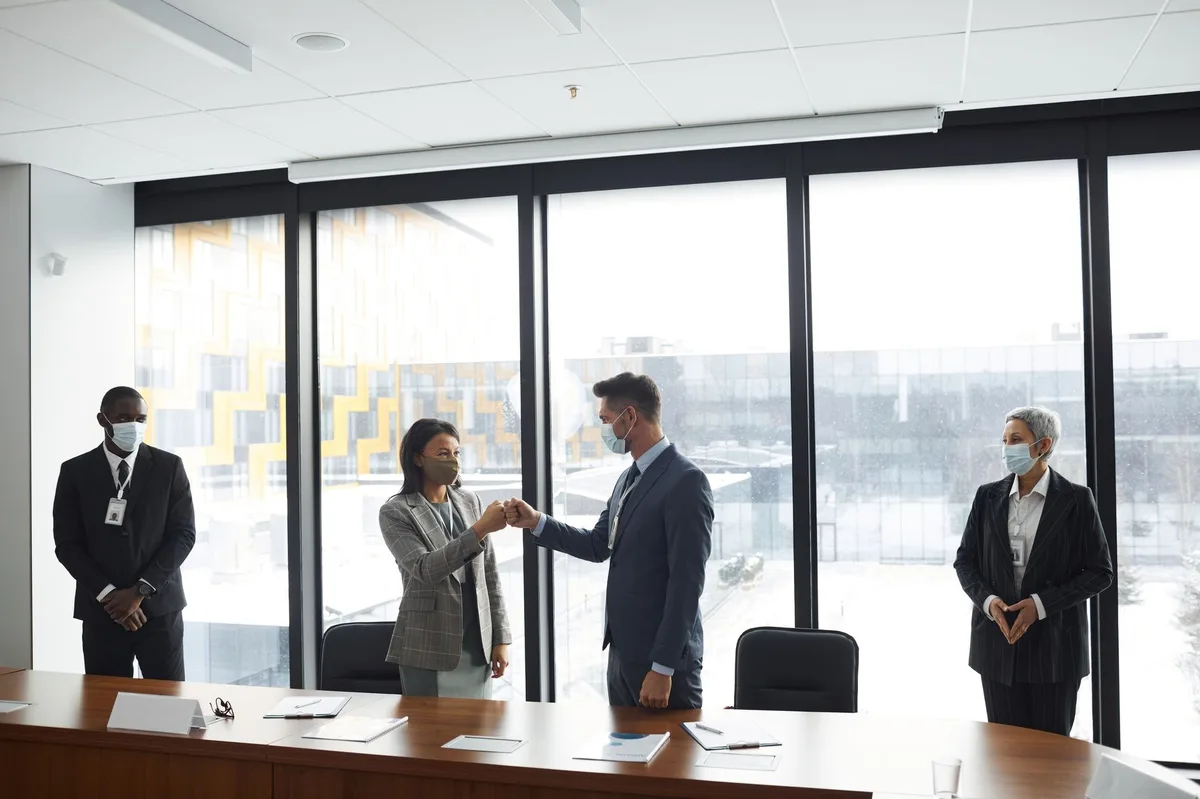 Business professionals in a corporate boardroom meeting discussing governance matters