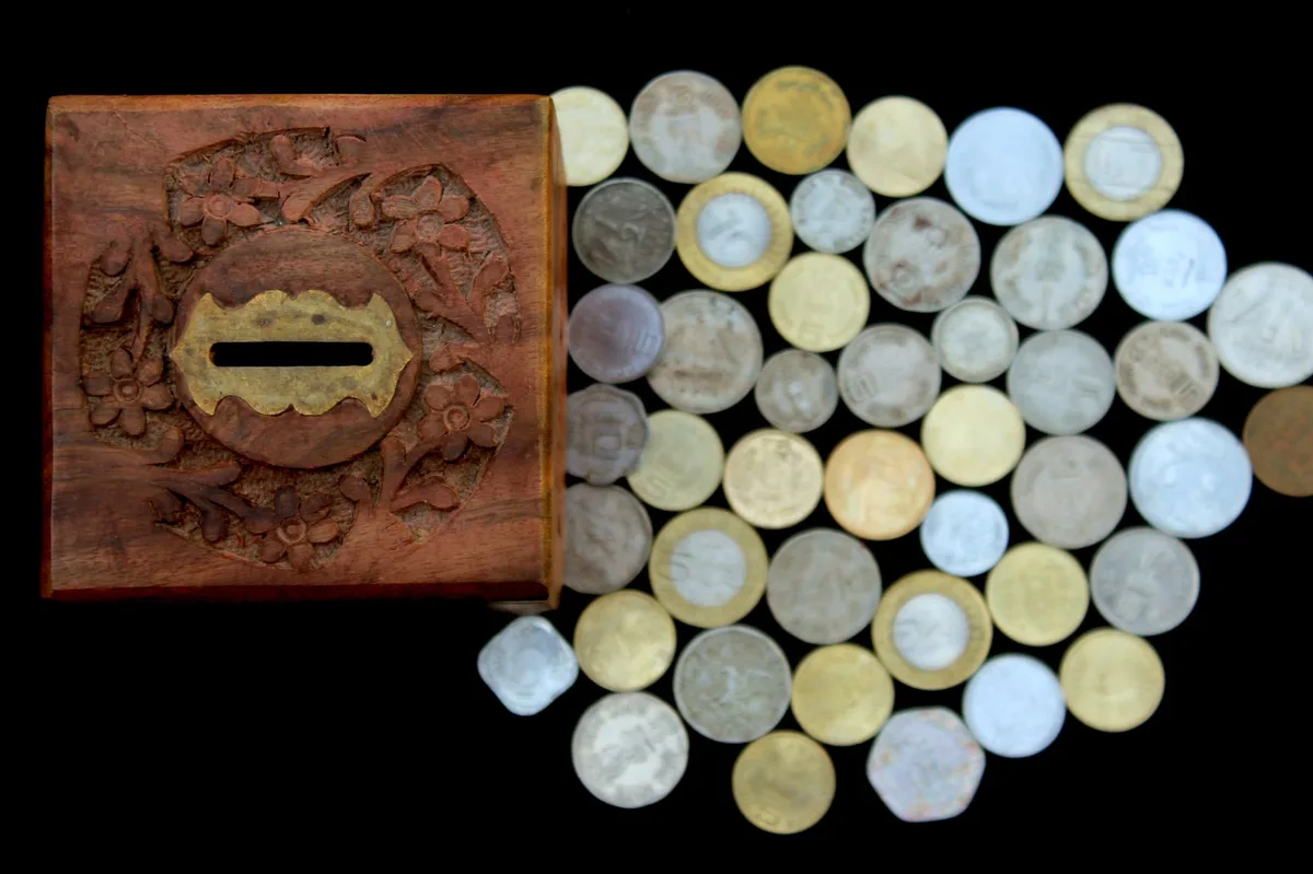 Piggy bank with Australian coins representing emergency savings fund