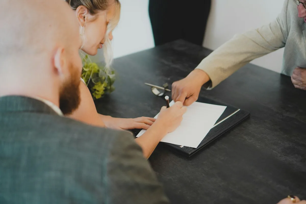 House keys and property contract on a desk representing first home purchase