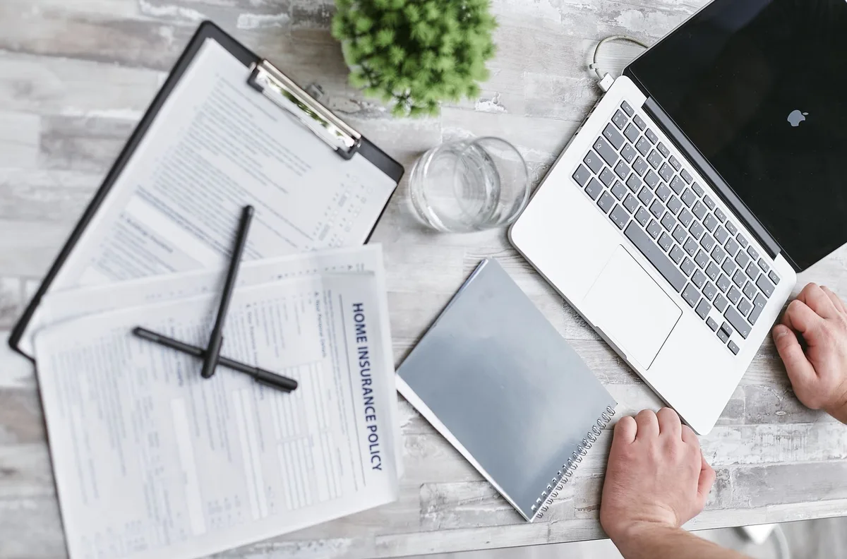 Documents and pen on desk for financial planning and debt review