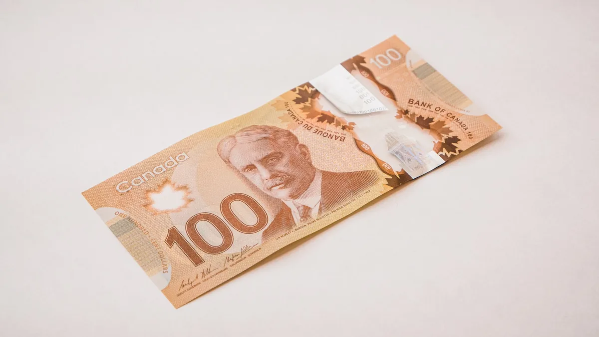 Canadian currency arranged on a banking surface representing fixed-income savings products