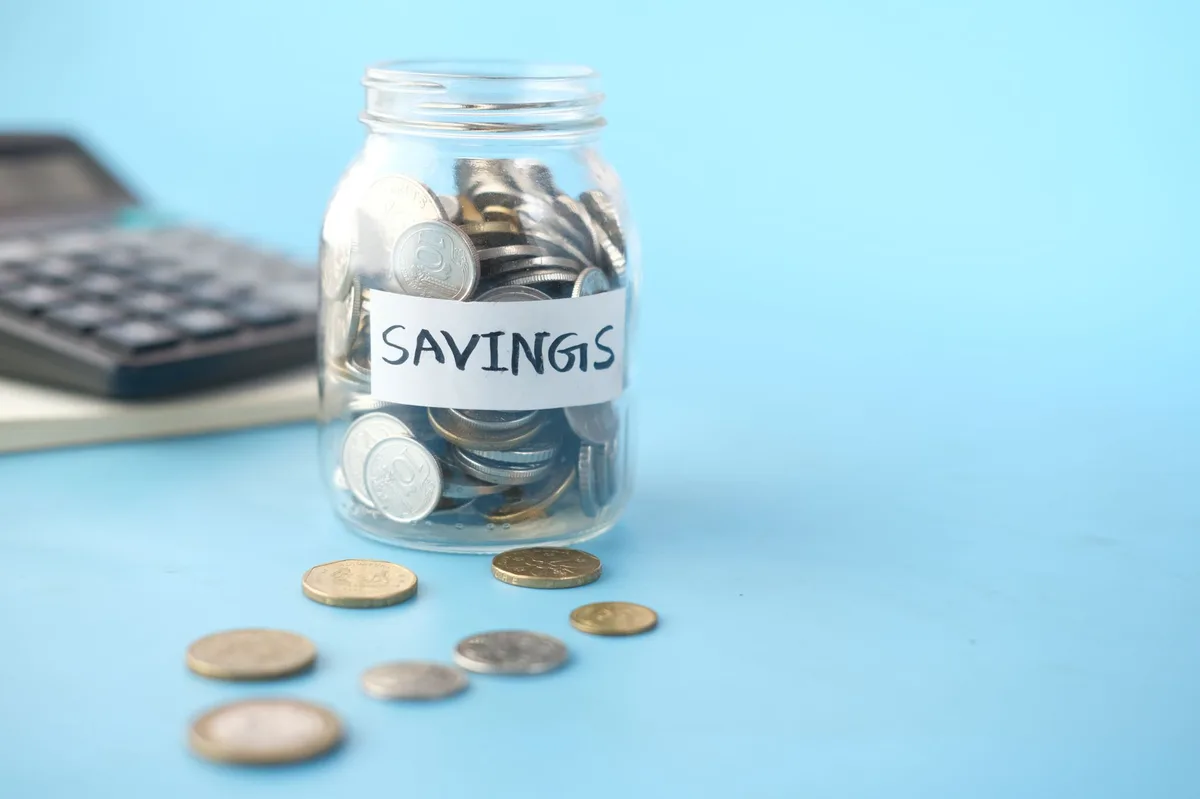 Piggy bank with Canadian coins representing RRSP and TFSA savings decisions