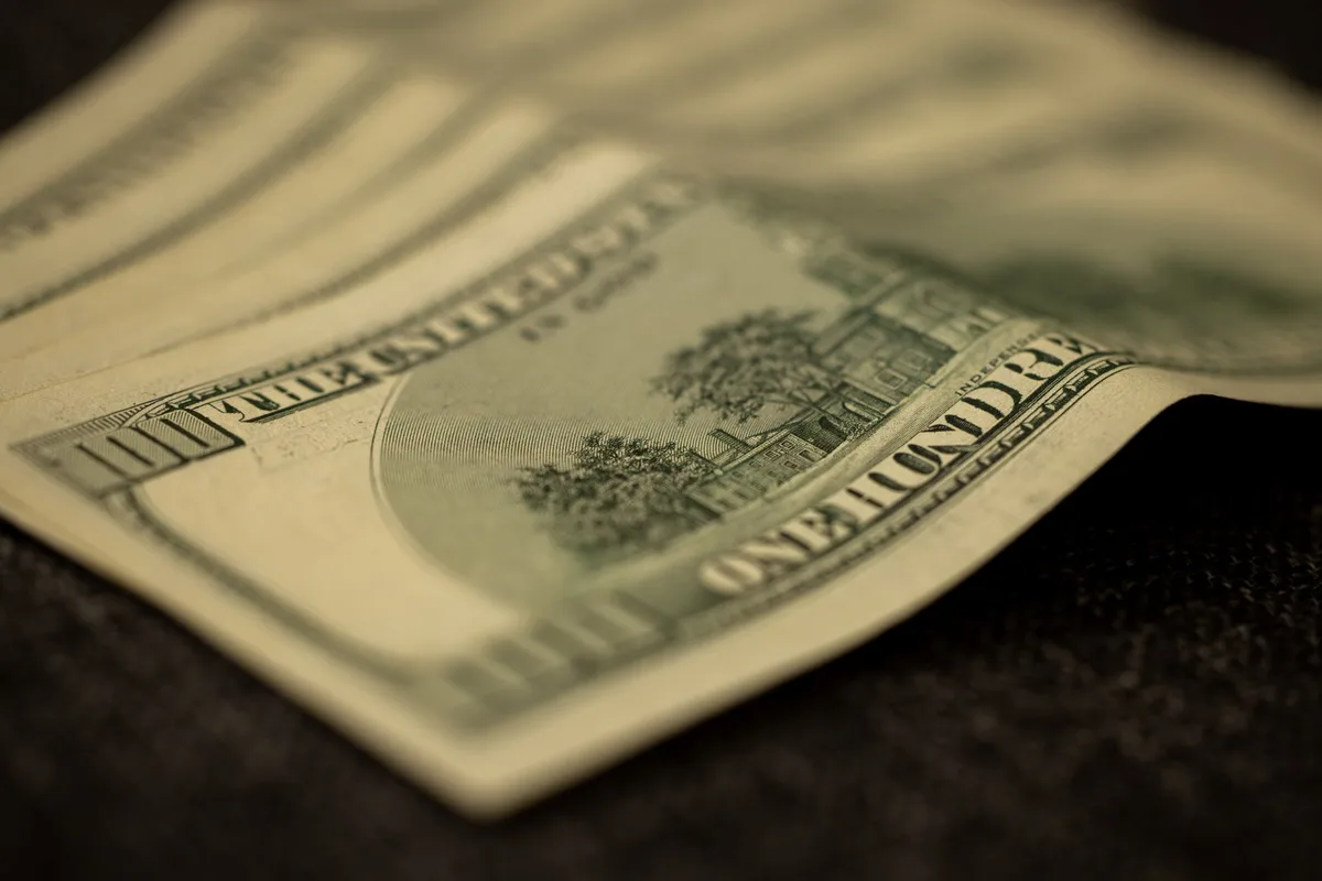 Canadian dollar bills representing dividend income from high-yield stocks