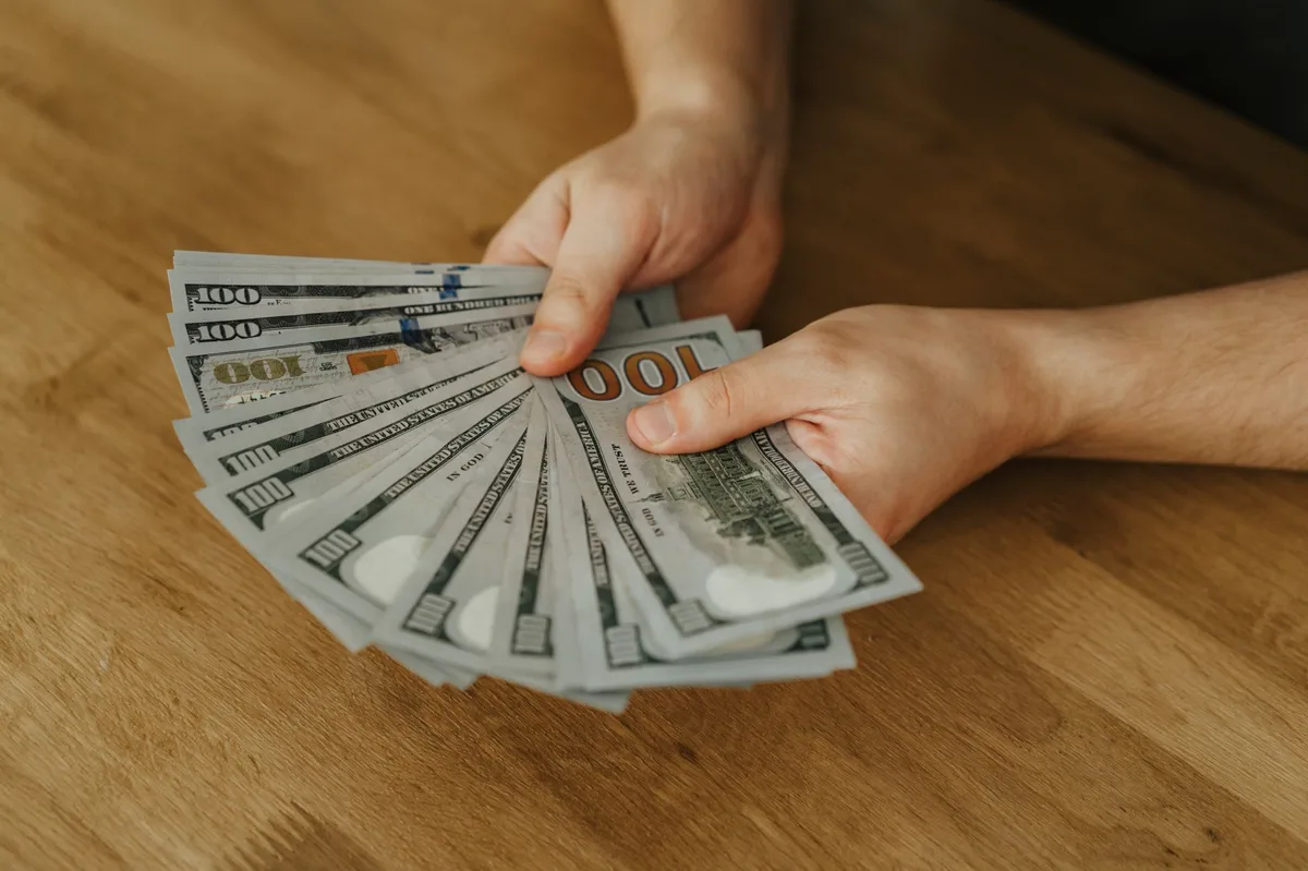 Close-up of Canadian dollar bills representing lottery winnings and financial planning