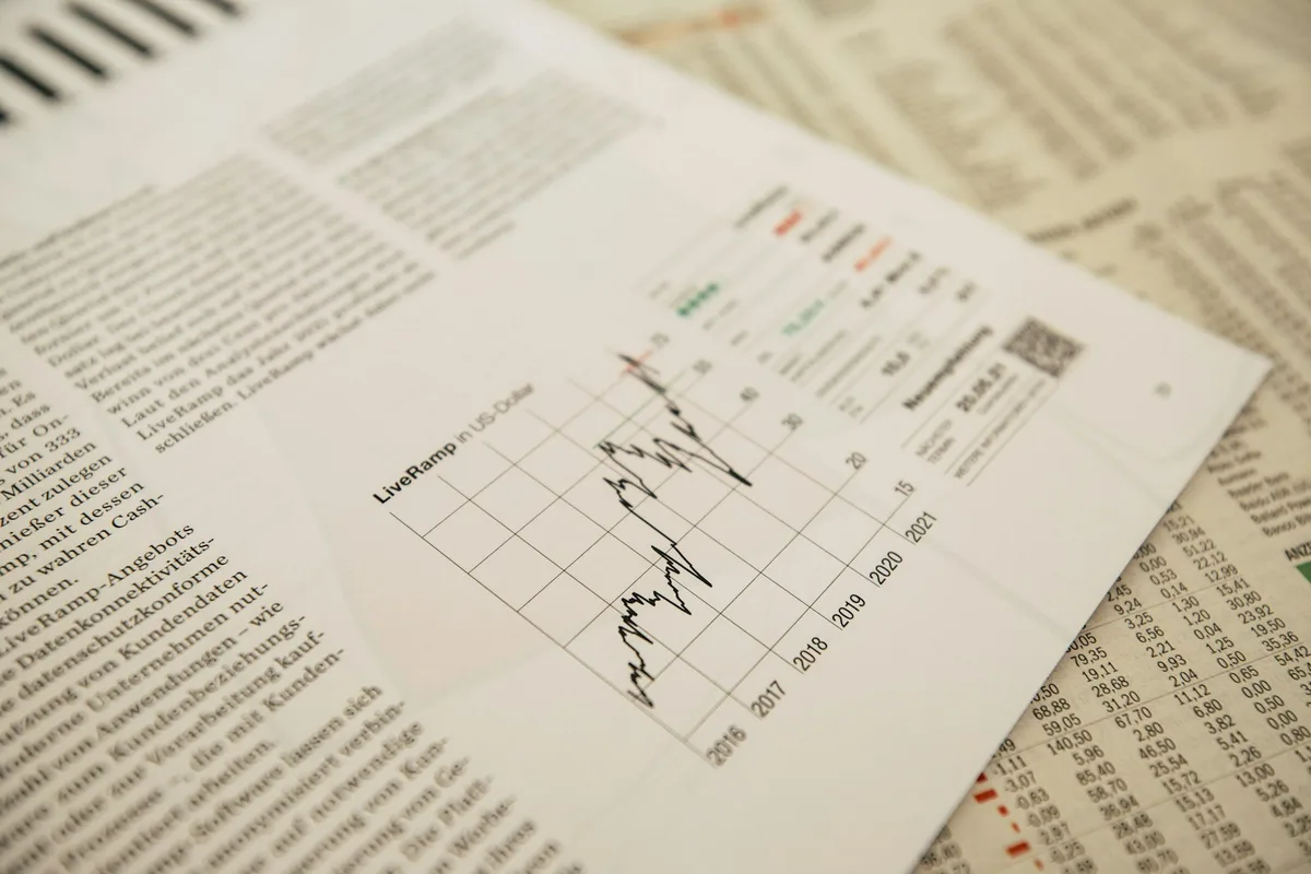 British financial newspaper showing economic headlines and interest rate data