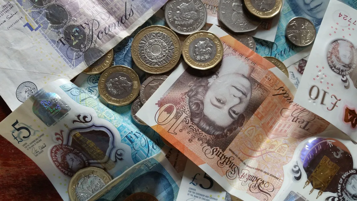 Piggy bank with coins representing savings and ISA accounts