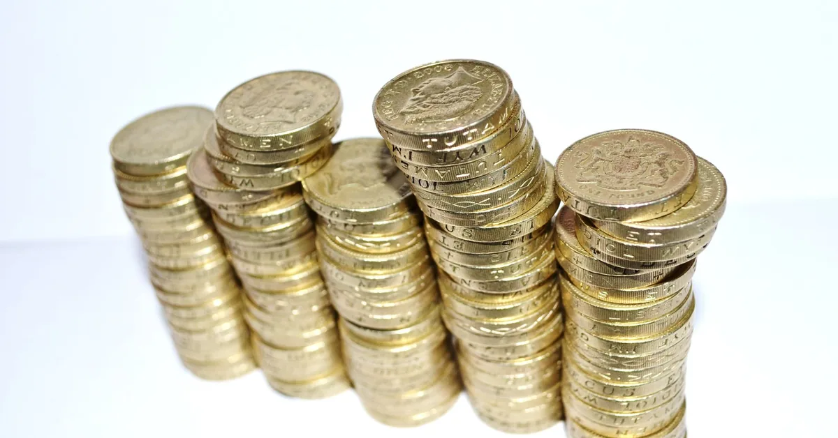 Coins and financial notes used to compare long-term investment returns.