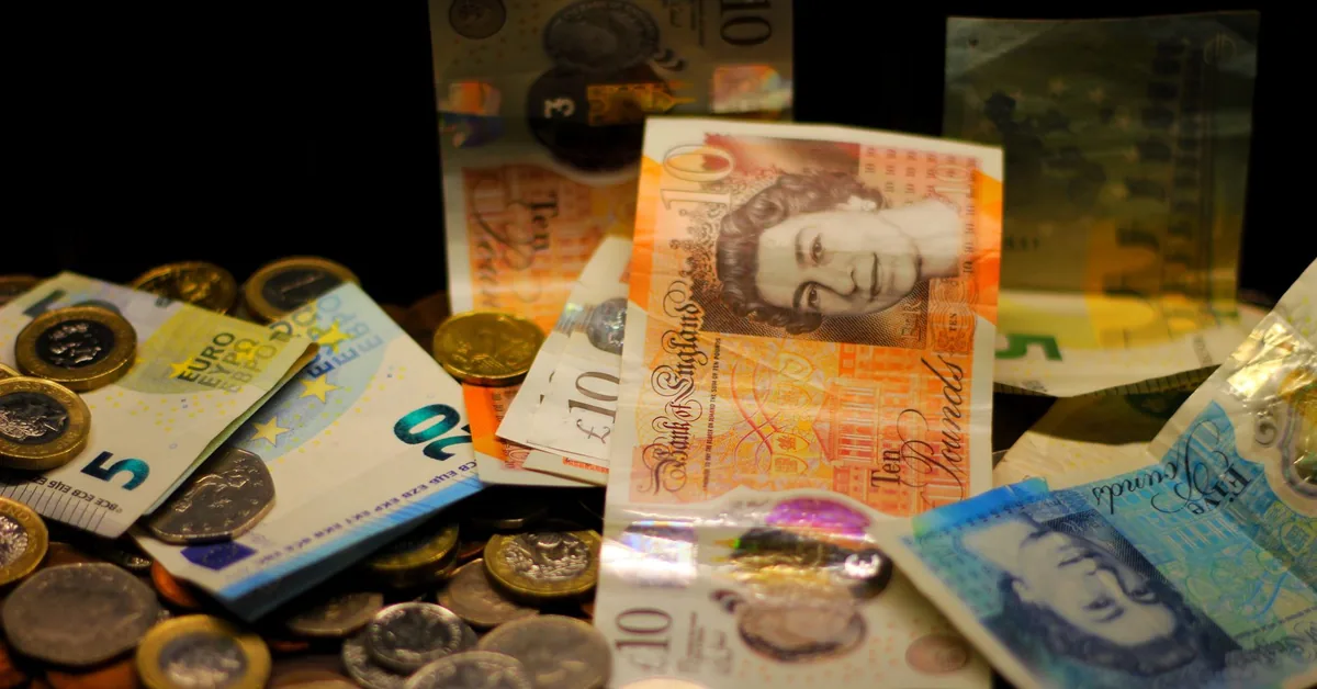 Piggy bank and coins on a table, representing savings and ISA cash balances.