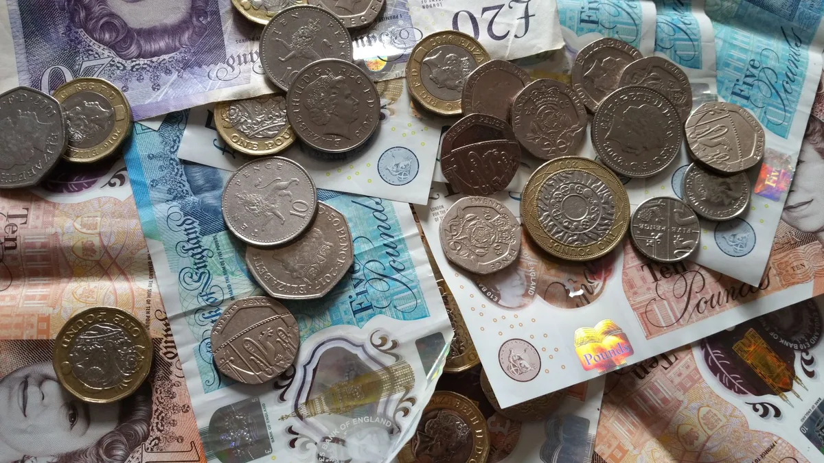 Piggy bank with coins representing ISA savings