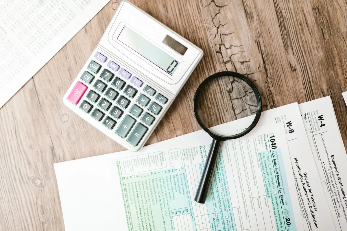 Tax documents with pen on desk ready for financial planning