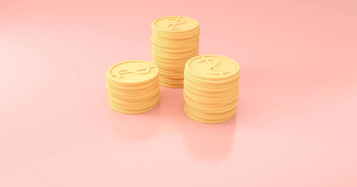 A close-up view of cash and savings notes on a desk.