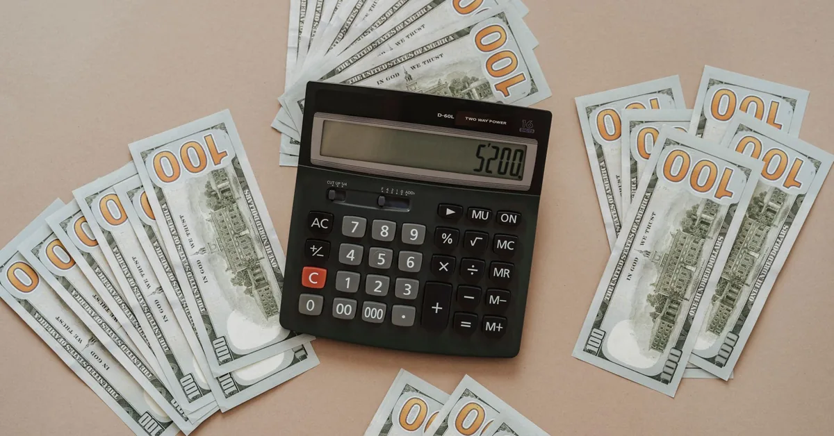 A calculator sitting on financial documents.