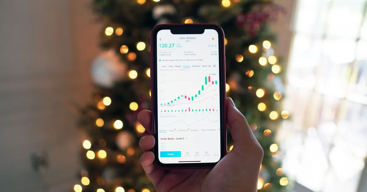 A person using a mobile finance app on a smartphone.