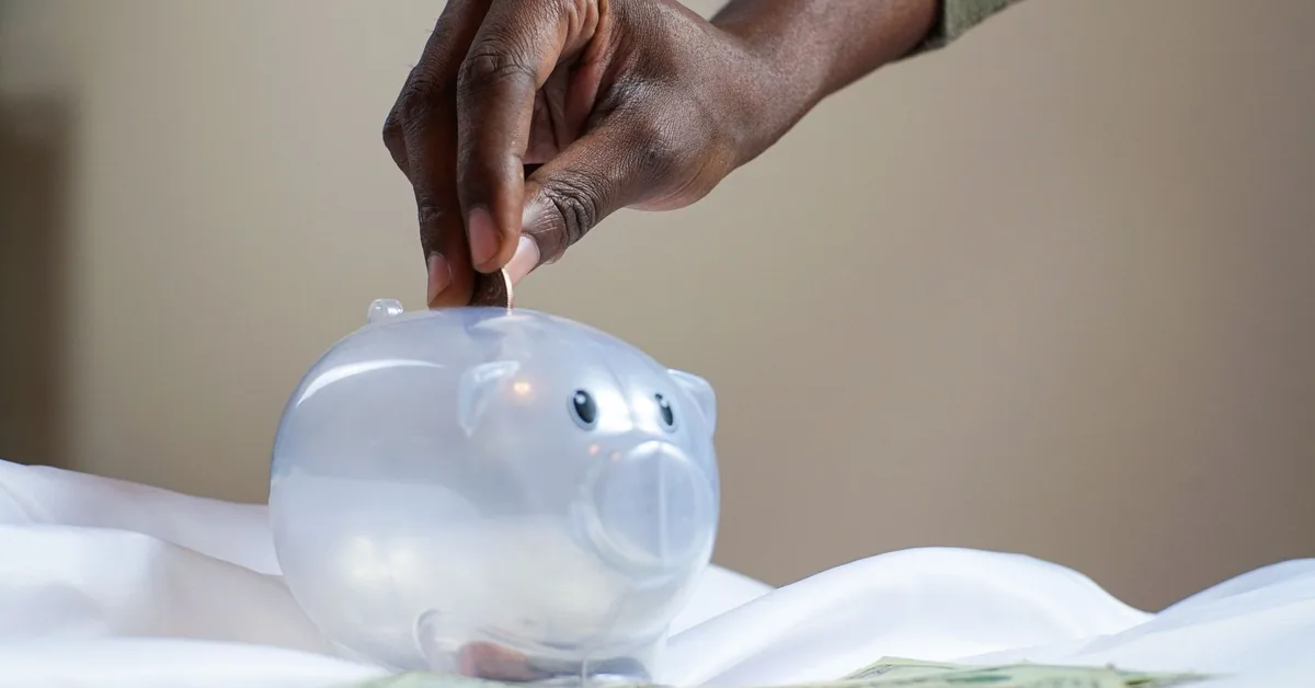 Piggy bank with coins representing emergency fund savings