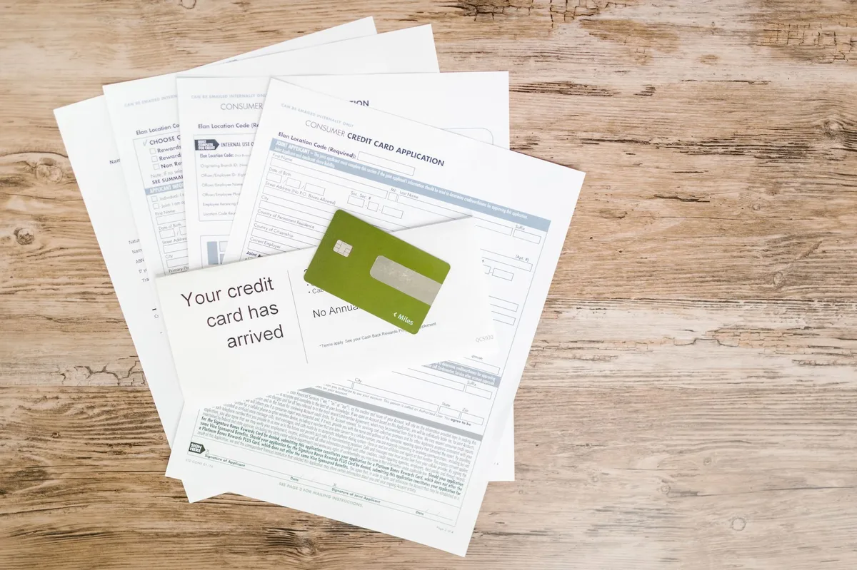 Documents and pen on a desk representing credit planning and financial documentation