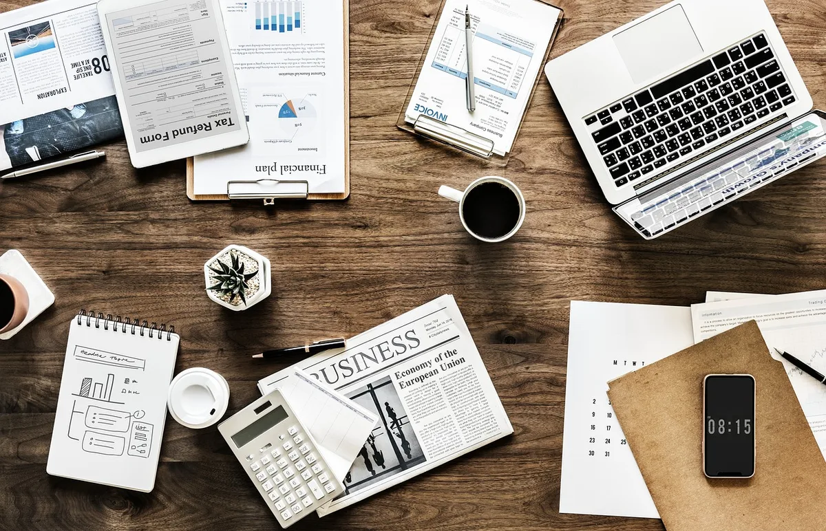 Financial planning desk with documents, calculator and pen for investment strategy