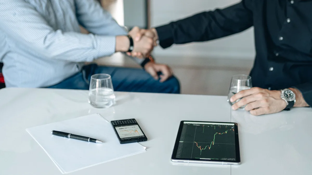 Business handshake representing investment partnership and trust